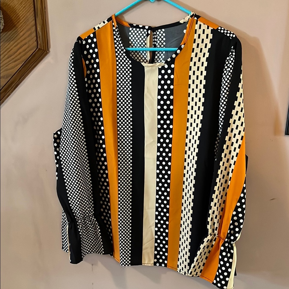 Black, White, Orange Ladies’ long sleeve blouse with mixed patterns. 🎃